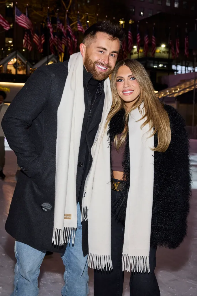 Jordan and Jessi Ngatikaura smiling and standing closely, both wearing white scarves.