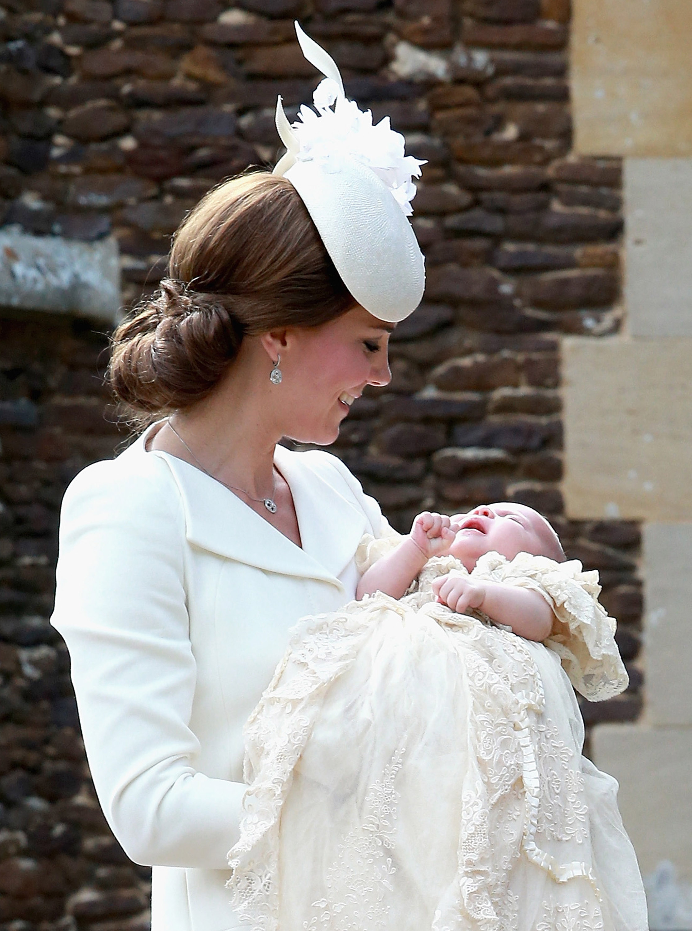 Catherine, Duchess of Cambridge, holding Princess Charlotte during her Christening.