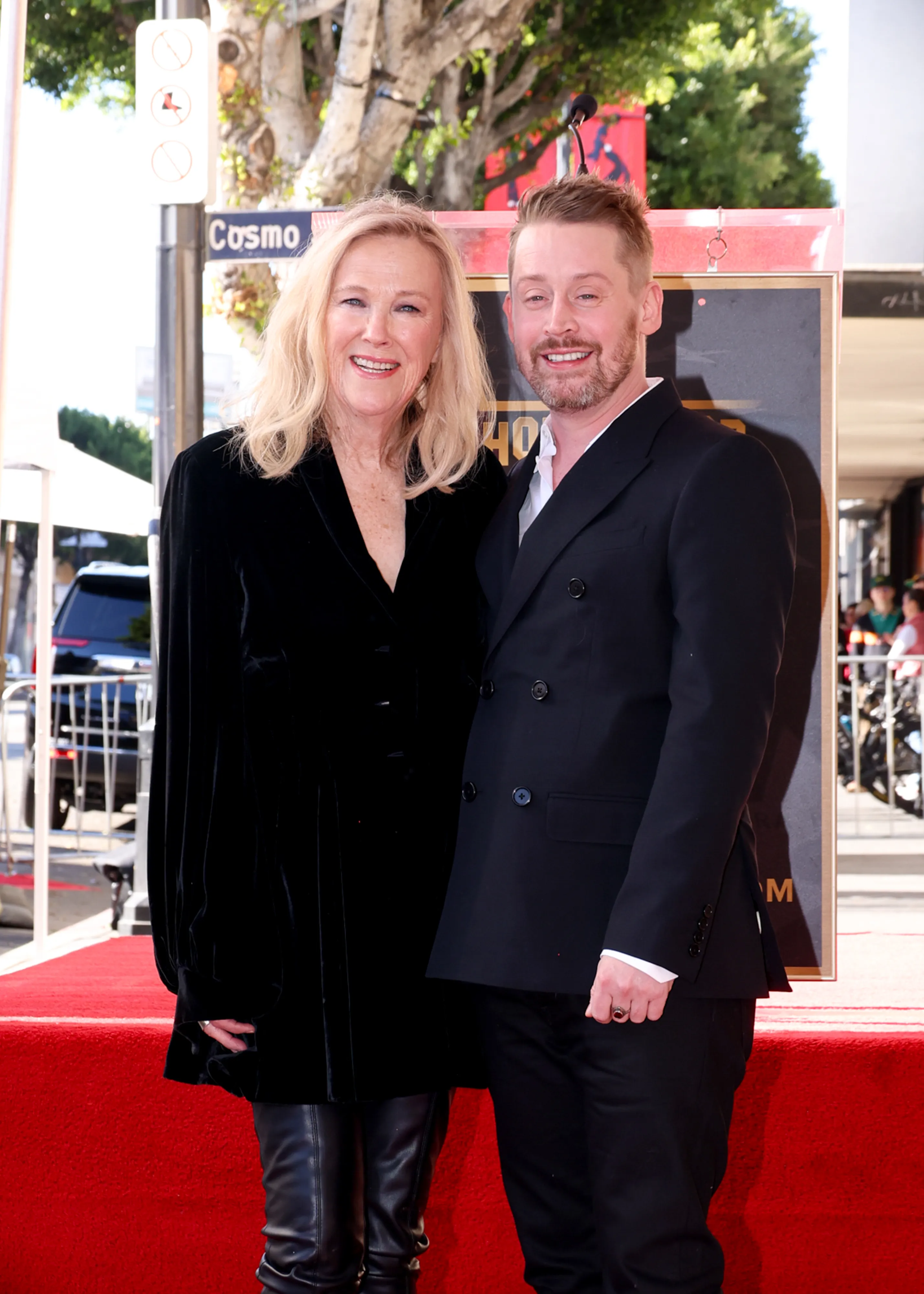 Catherine O'Hara and Macaulay Culkin smile on the red carpet at his Hollywood Walk of Fame ceremony.