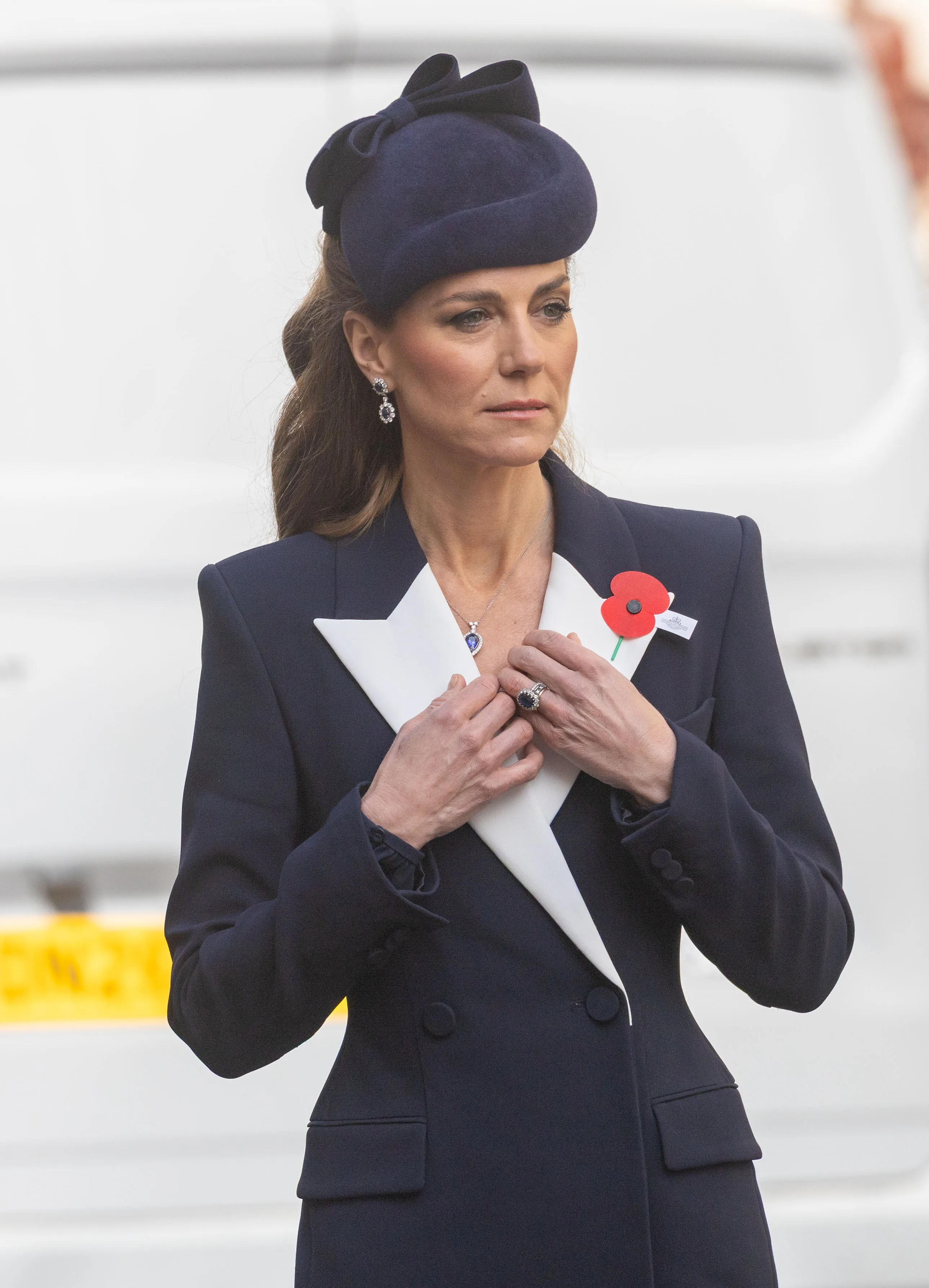 Catherine, Princess of Wales, in a navy coat and hat, at the Anzac Day ceremony.