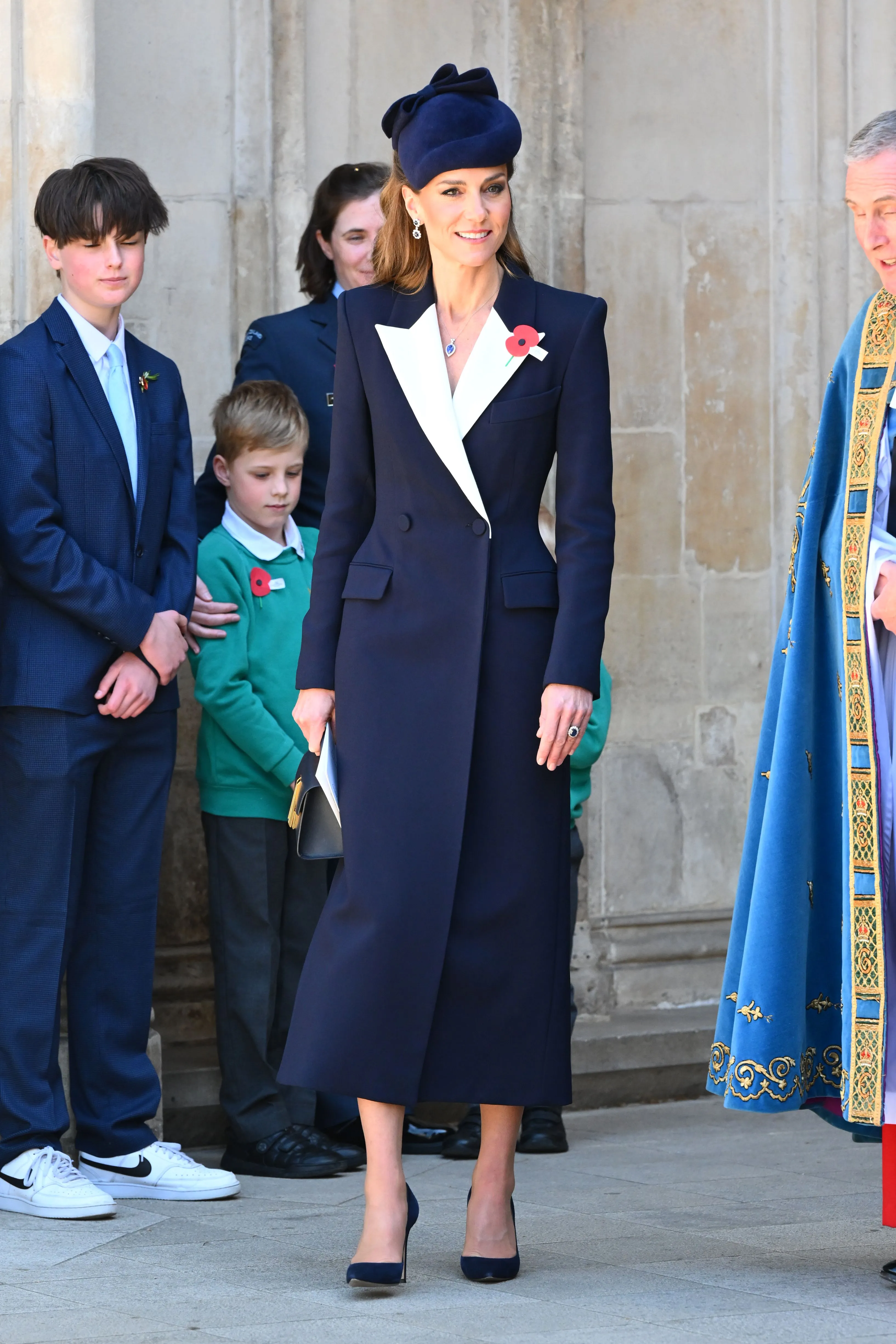 Catherine, Princess of Wales, in a navy coat and hat, at the ANZAC Day Service in Westminster Abbey.