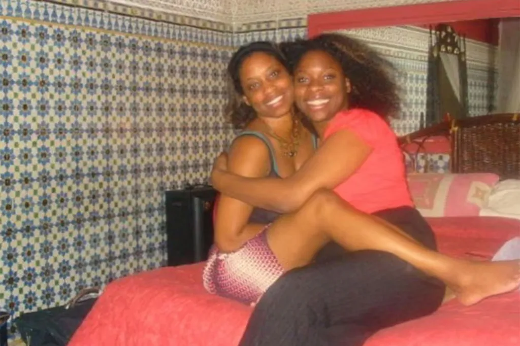 Two young woman hugging each other
