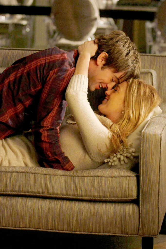 Blake Lively lying on a couch with Chace Crawford leaning over her, their faces almost touching.