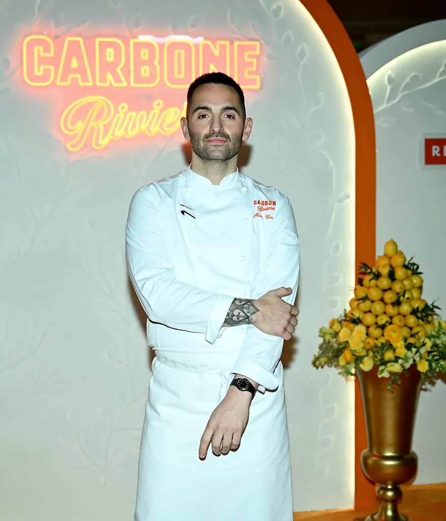 Chef Mario Carbone in a white chef's coat at the grand opening of CARBONE RIVIERA.
