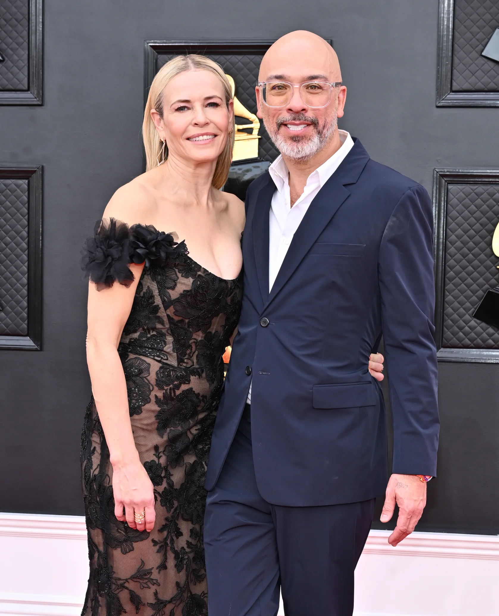Chelsea Handler and Jo Koy pose together at the 64th Annual Grammy Awards.