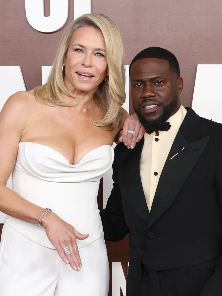 Chelsea Handler in a white strapless outfit with Kevin Hart in a black tuxedo at Netflix Is A Joke Fest.