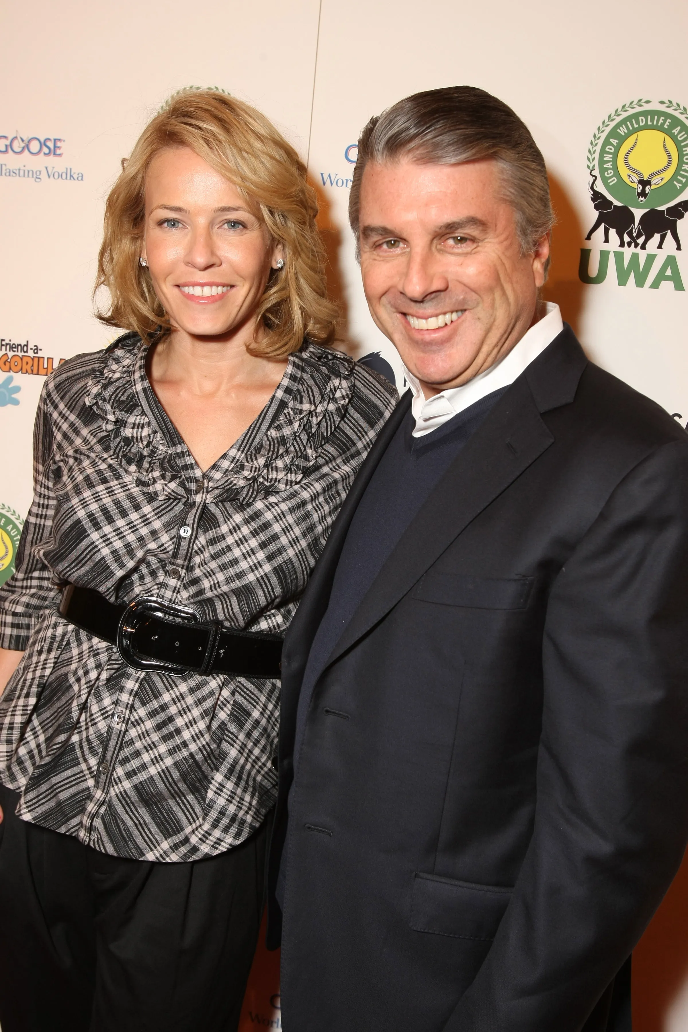 Chelsea Handler and Ted Harbert smiling at an event for the Uganda Wildlife Authority.