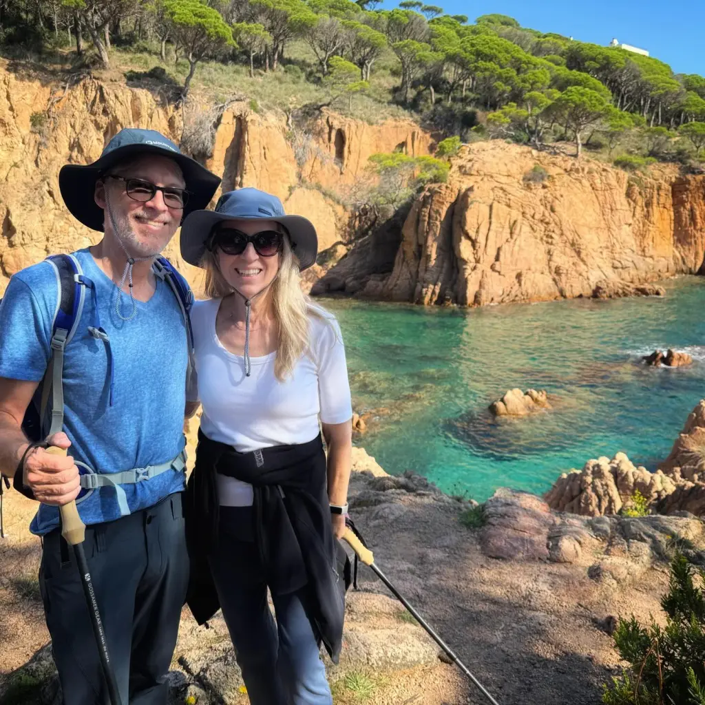 Cheryl Strayed and her husband, Brian Lindstrom, hiking along a coastline.