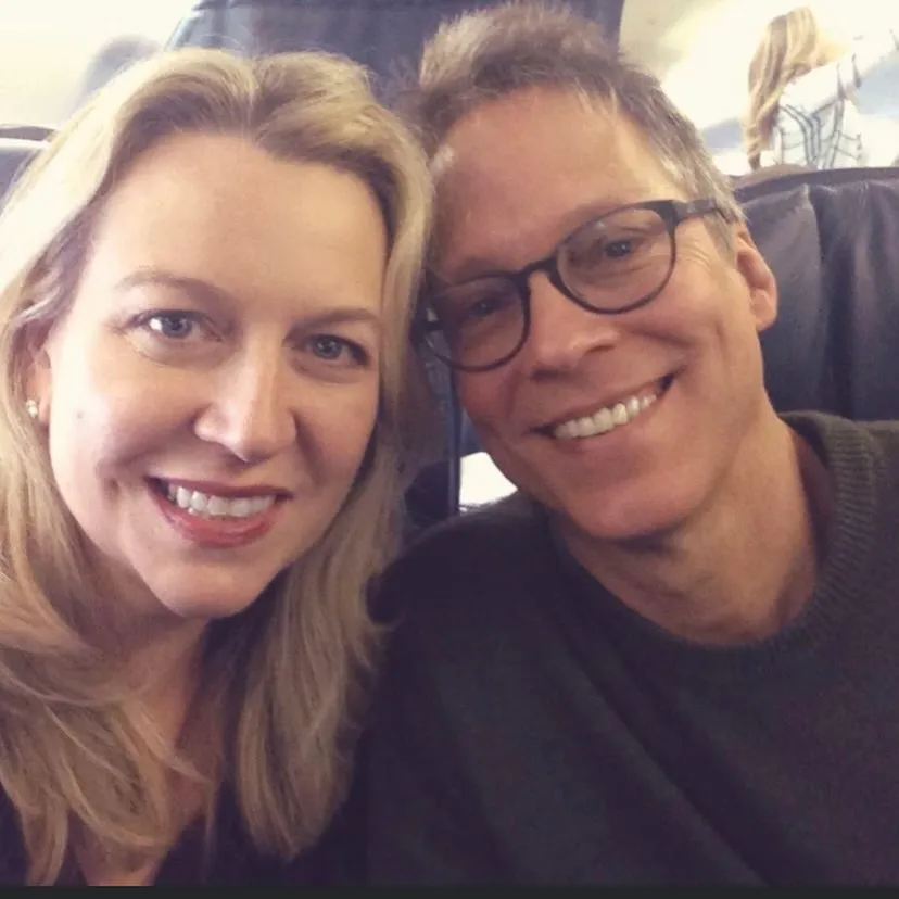 Cheryl Strayed and her husband Brian Lindstrom smiling.