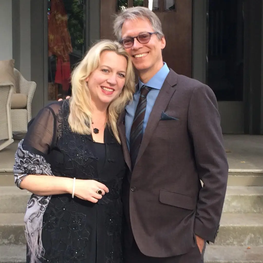 Cheryl Strayed and her husband, Brian Lindstrom, smiling and embracing.
