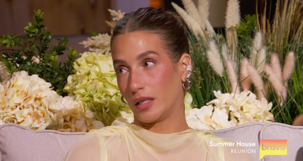 Ciara Miller looking to the left with a surprised expression during the 