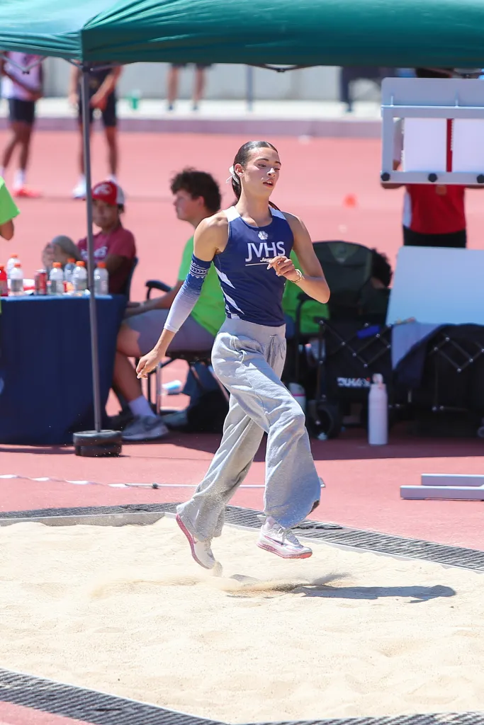 CIF Track & Field student A.B. Hernandez competing in the triple jump.