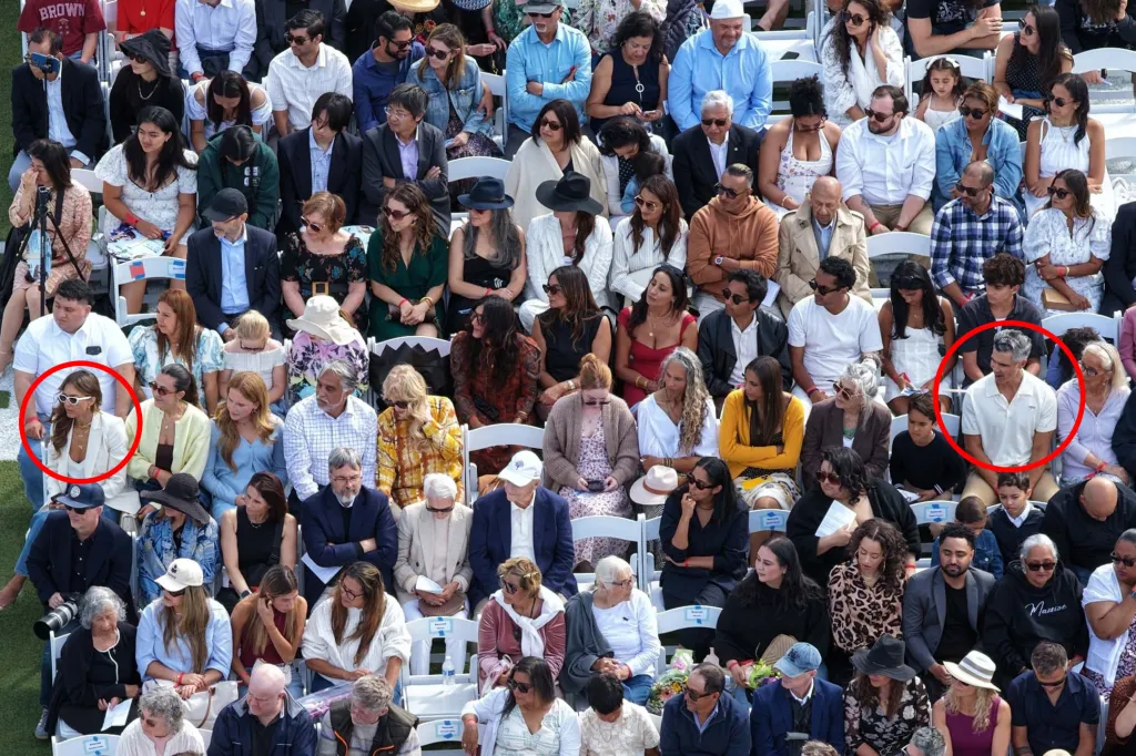 Jessica Alba and Cash Warren sitting apart at their daughter's graduation ceremony.