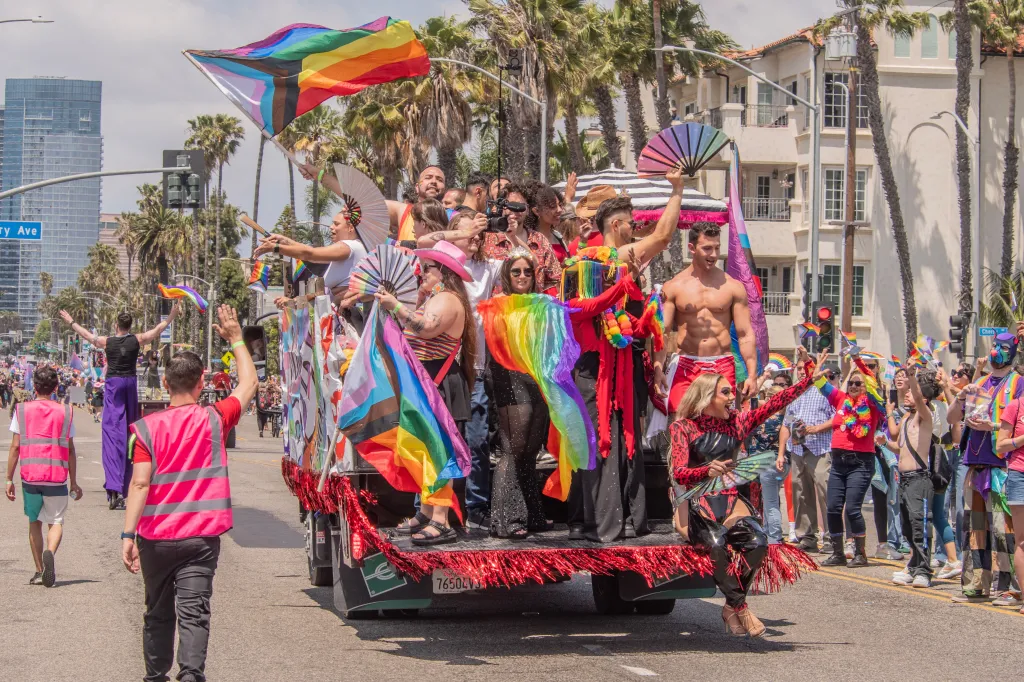 A group of people celebrating on a parade float for the 42nd Annual Long Beach Pride Parade.