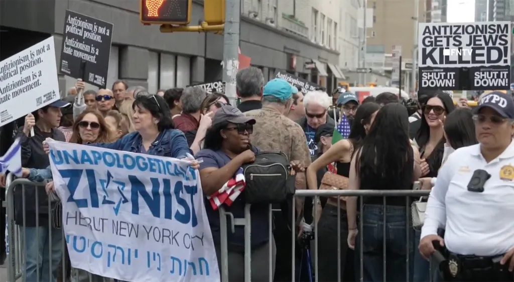 People protesting outside the Park East Synagogue in NYC.