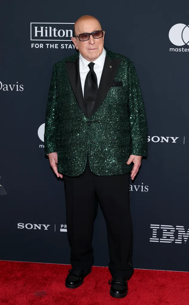 Clive Davis in a green sequined blazer, black pants, and sunglasses attends the Pre-GRAMMY Gala.