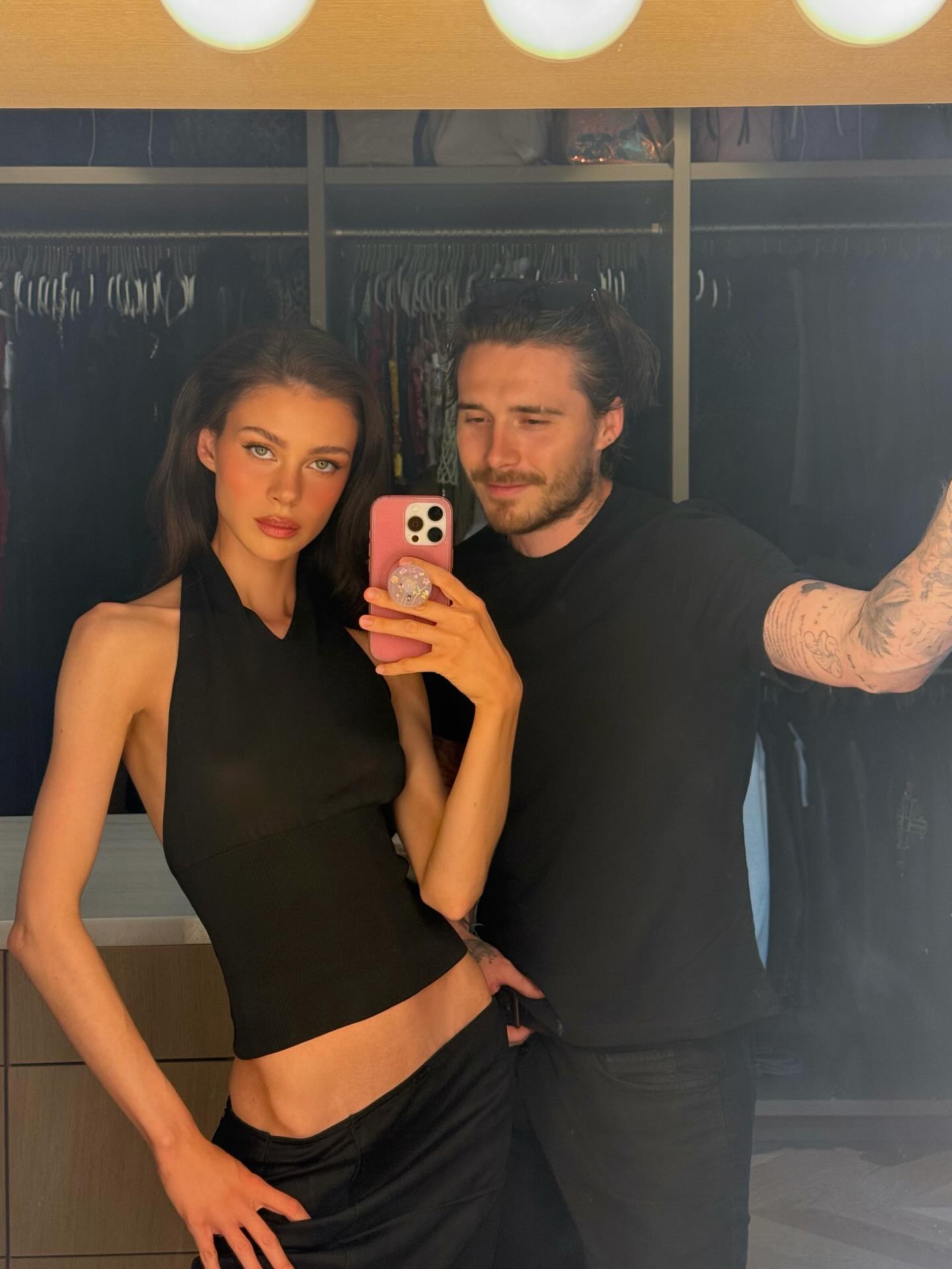 Nicola Peltz and Brooklyn Beckham pose for a mirror selfie.