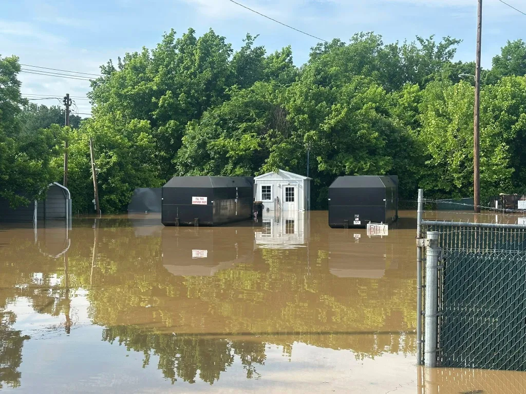 A home in Cocke County is surrounded by flood water.