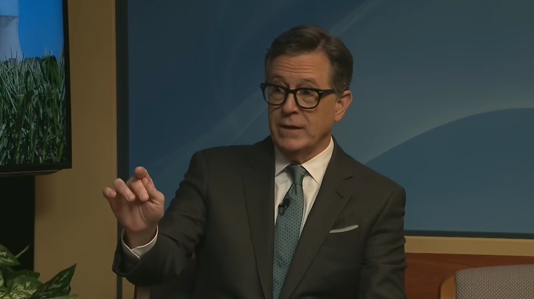 Stephen Colbert speaking during an interview.