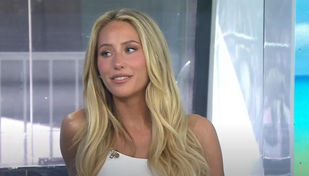 Alix Earle in a white top.