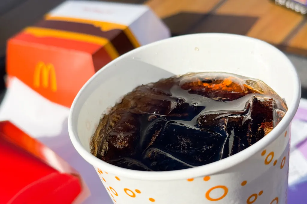 A cup of Coca-Cola with ice at McDonald's.