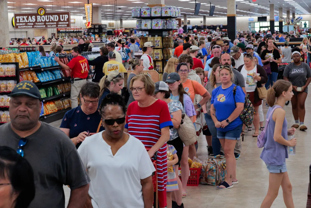 Customers wait in long lines to purchase their food, merchandise and other goods during the grand opening of the first Buc-ee's location on the East Coast on June 30, 2025 in Mount Crawford, Virginia.