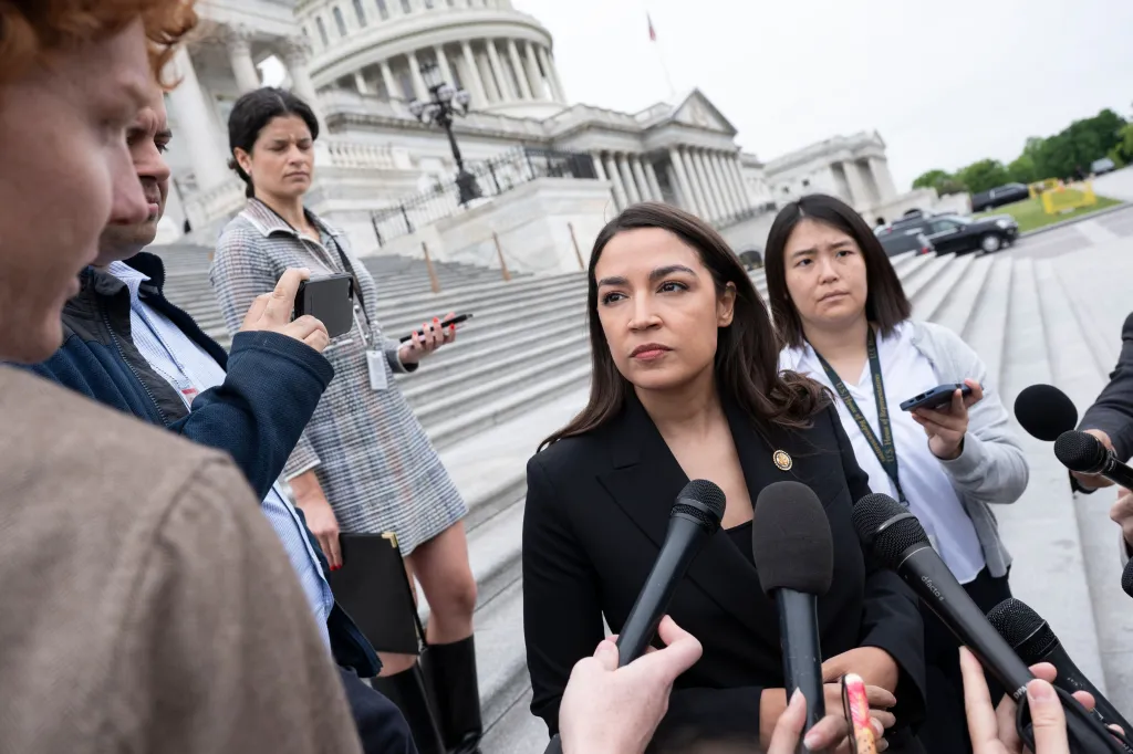 US Representative Alexandria Ocasio-Cortez speaks to reporters outside the US Capitol Building.