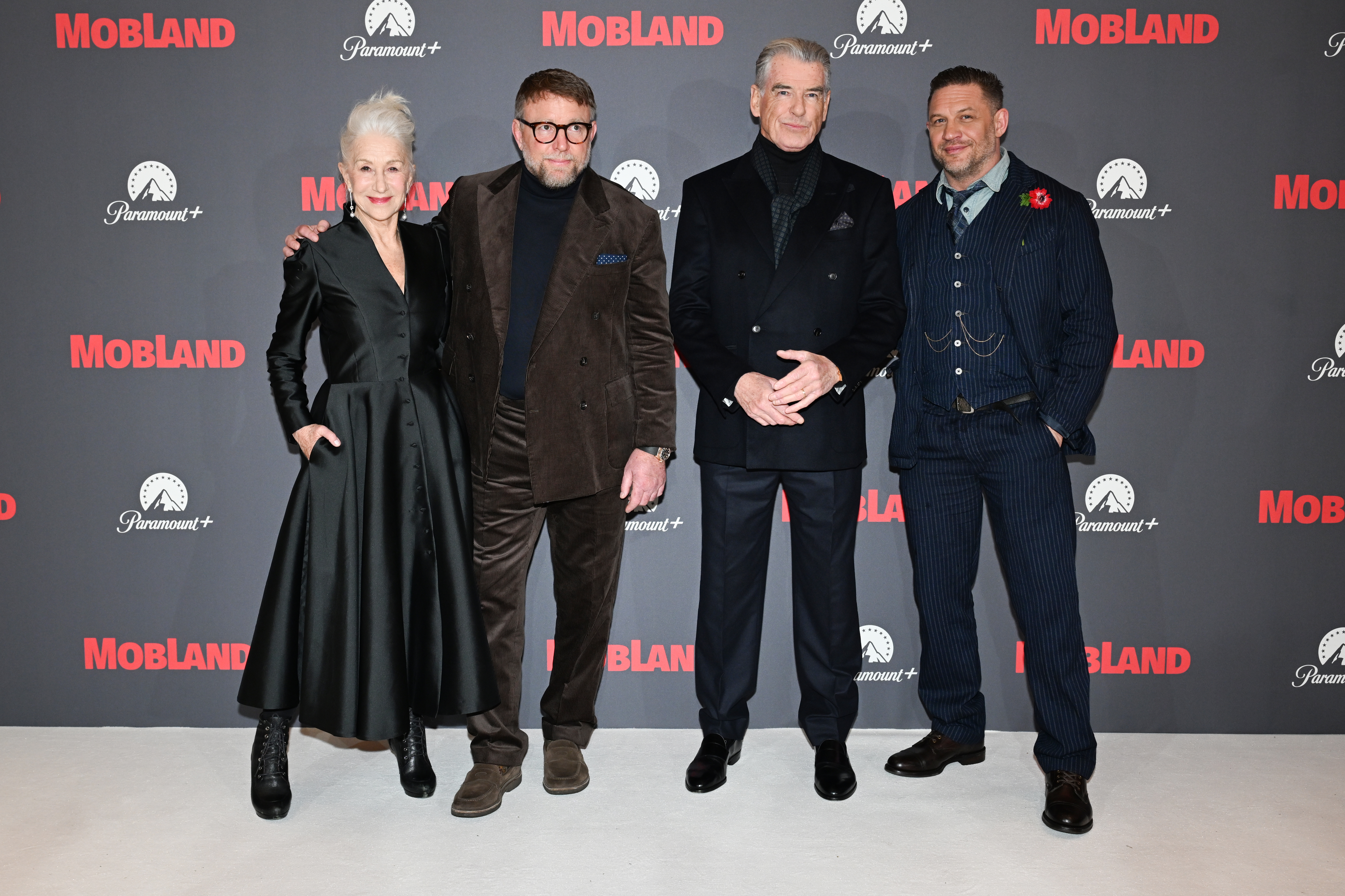 Helen Mirren, Guy Ritchie, Pierce Brosnan, and Tom Hardy at the premiere of
