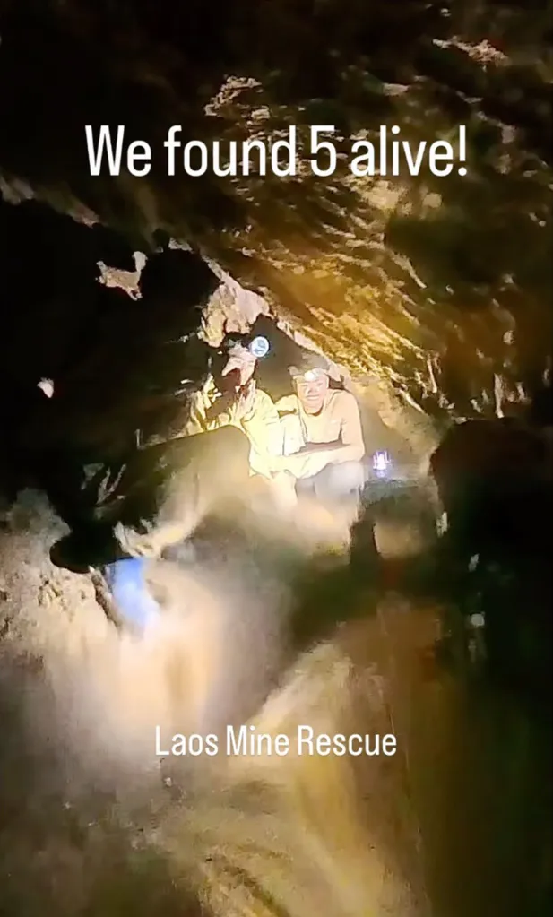 Rescuers in a cave in Laos, with text 