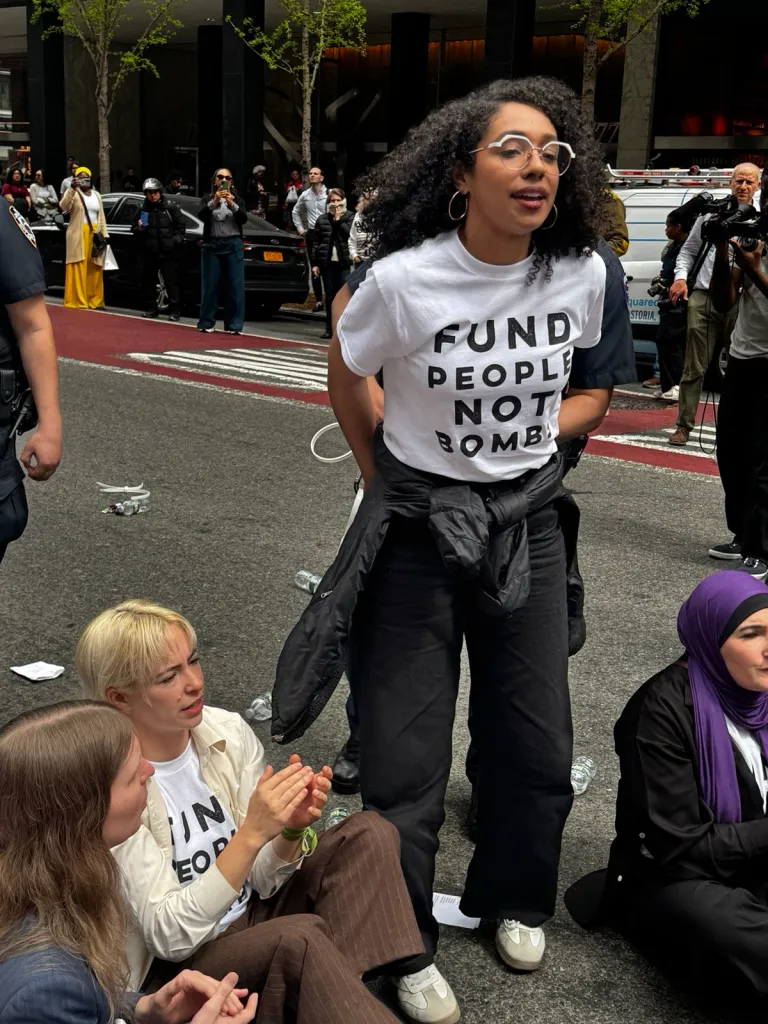 Darializa Avila Chevalier is detained by police after blocking a street in New York during a protest on April 13, 2026.