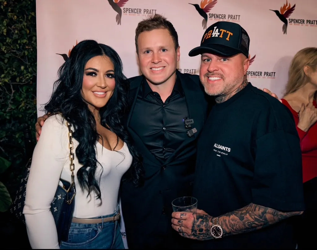 Three people smiling at a 