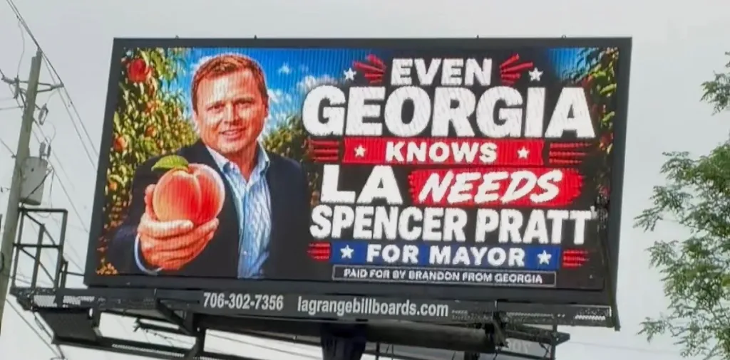 Billboard with a picture of Spencer Pratt holding a peach, with text that says 