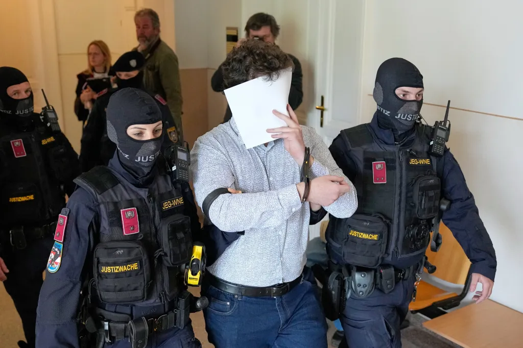 Defendant Beran A. wears a new shirt as he is returned to the courtroom in the District Court in Wiener Neustadt, Austria, where he stands trial for plotting to carry out an attack on one of superstar singer Taylor Swift's concerts in Vienna in August 2024 and pledging allegiance to the Islamic State group, Tuesday, April 28, 2026.