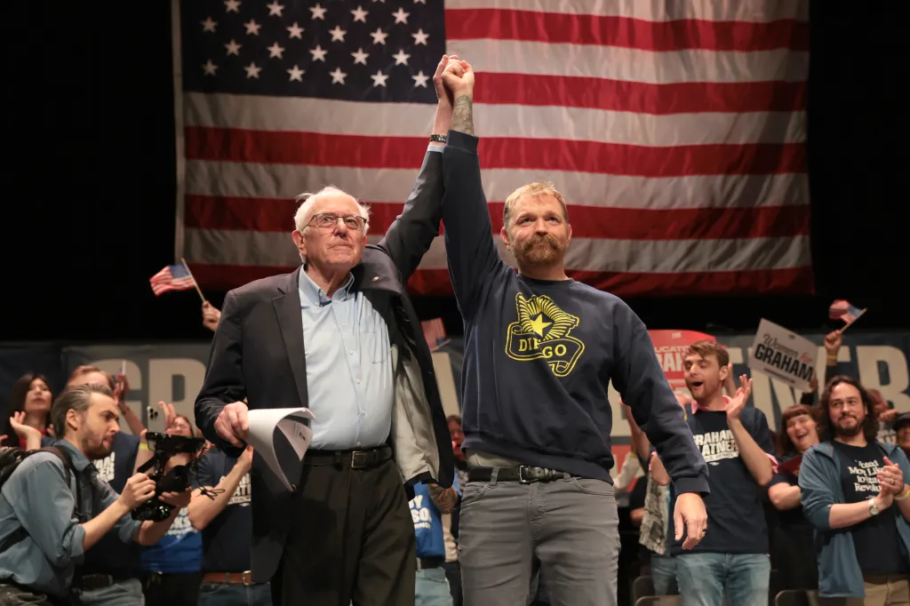 Sen. Bernie Sanders (I-VT) and Democratic US Senate candidate Graham Platner stand together during a Fighting Oligarchy tour stop at the Collins Center for the Arts on the University of Maine campus on May 24, 2026 in Orono, Maine.