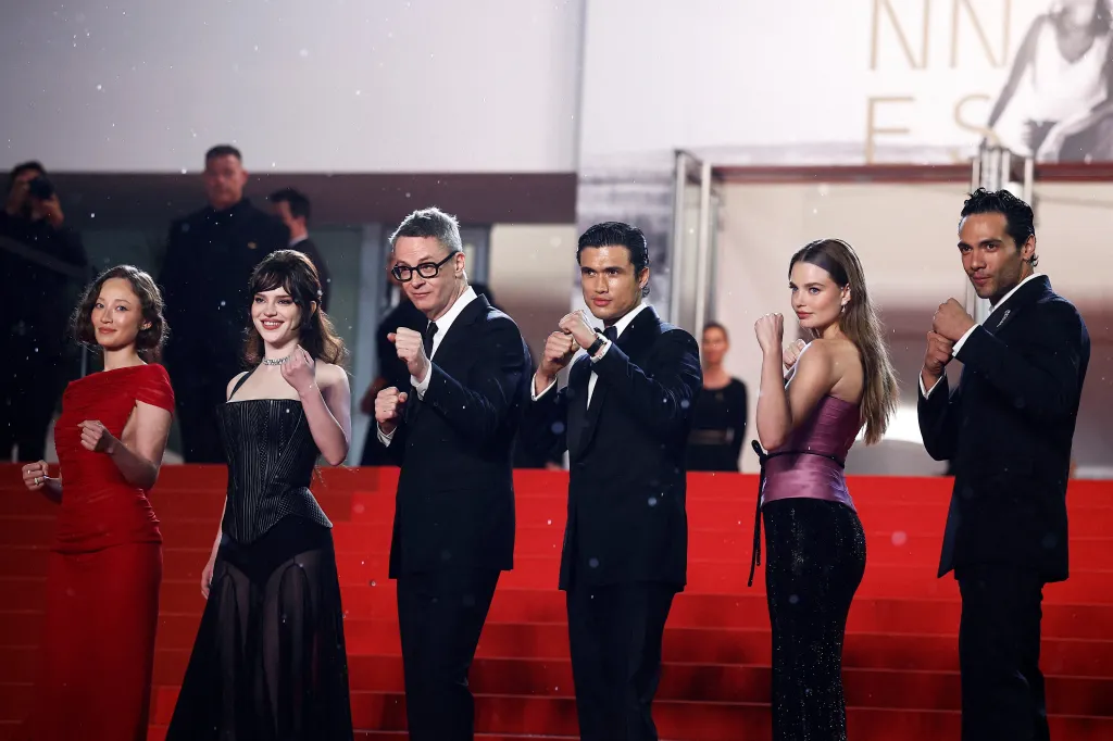 Havana Rose Liu, Sophie Thatcher, Nicolas Winding Refn, Charles Melton, Kristine Froseth, and Diego Calva pose on the red carpet during arrivals for the screening of the film