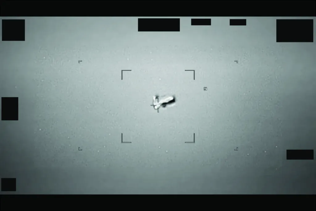 Infrared camera footage showing an Unidentified Anomalous Phenomena (UAP) being tracked by a targeting system.