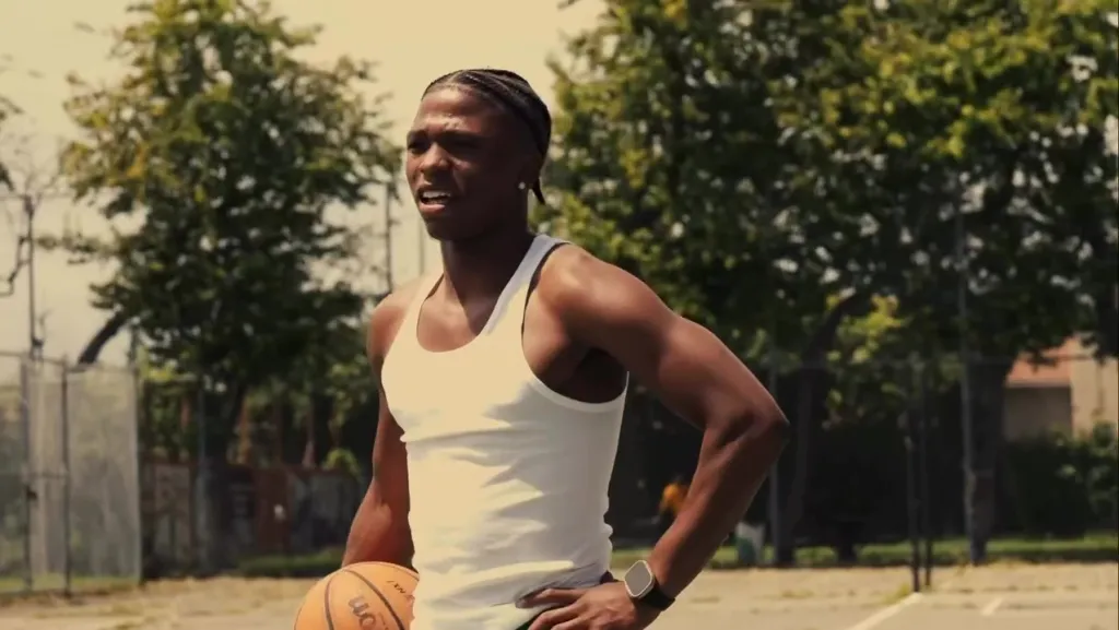 Dominic Antoine Jr. on a basketball court, holding a basketball.