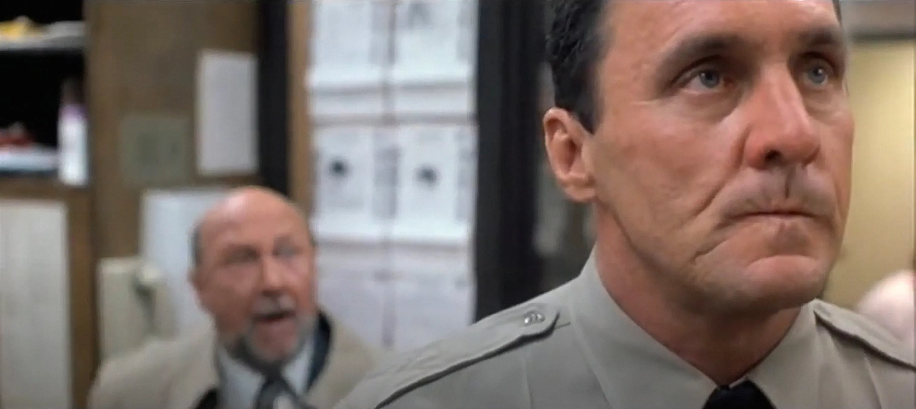 Beau Starr as Sheriff Ben Meeker and Donald Pleasence as Dr. Sam Loomis in 