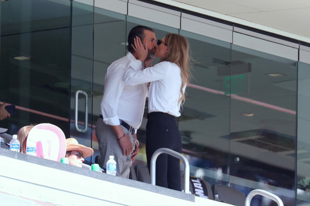 Donald Trump Jr. and Bettina Anderson share a kiss at the FIFA Club World Cup.