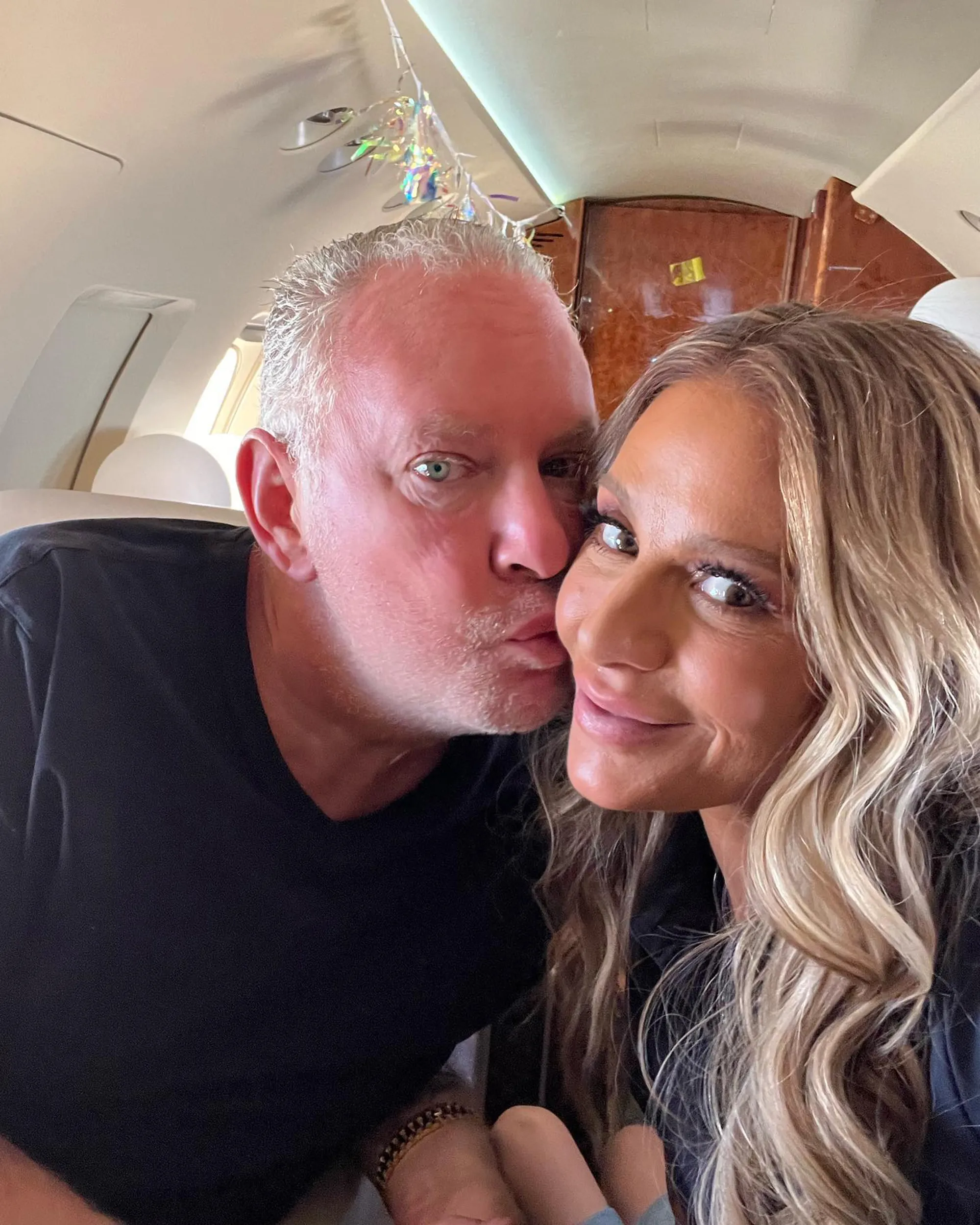 Dorit Kemsley and Paul 'PK' Kemsley posing together inside a private jet.