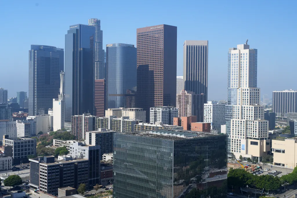 Downtown Los Angeles skyline including One California Plaza, Two California Plaza, Gas Company Tower, US Bank Tower, and Wells Fargo Center buildings.