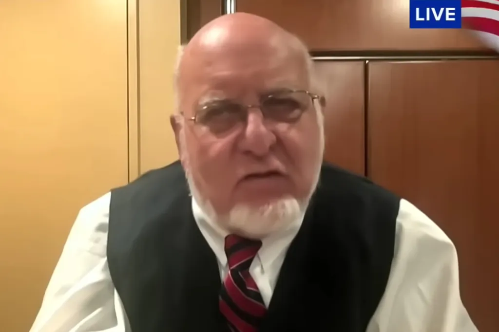 Former CDC director Dr. Robert Redfield speaks during an interview.