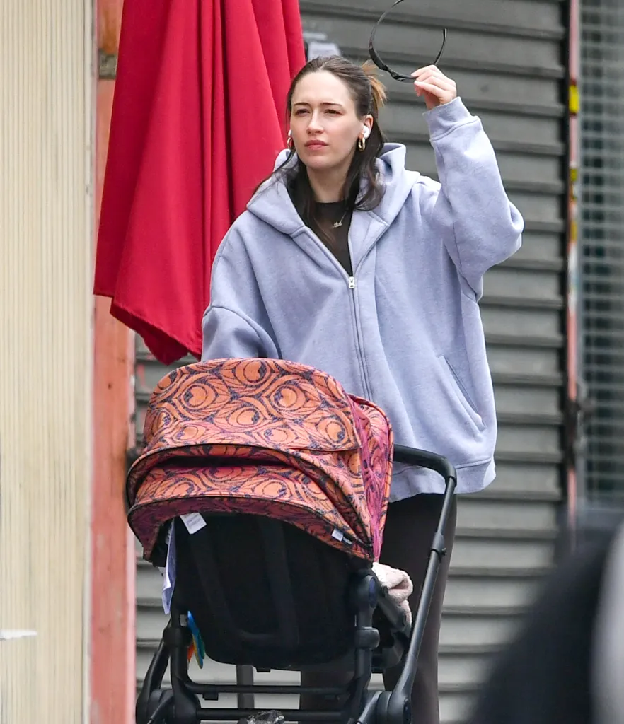 Elise Hewitt pushing a baby stroller in New York City.