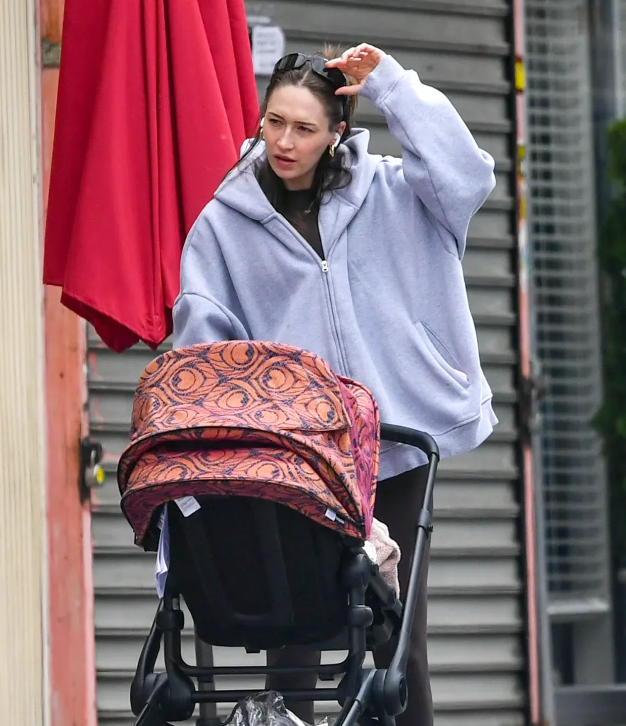 Elise Hewitt pushing a patterned pram while out in New York City.