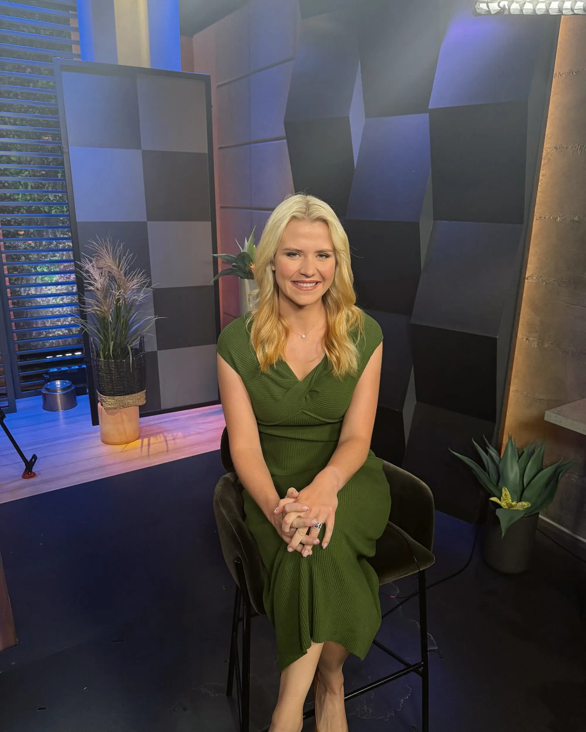 Elizabeth Smart seated in a green dress.