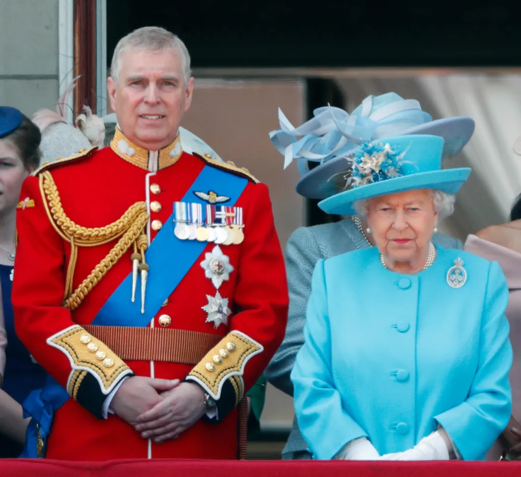Prince Andrew and Queen Elizabeth II watching a flypast from the balcony of Buckingham Palace during Trooping The Colour.