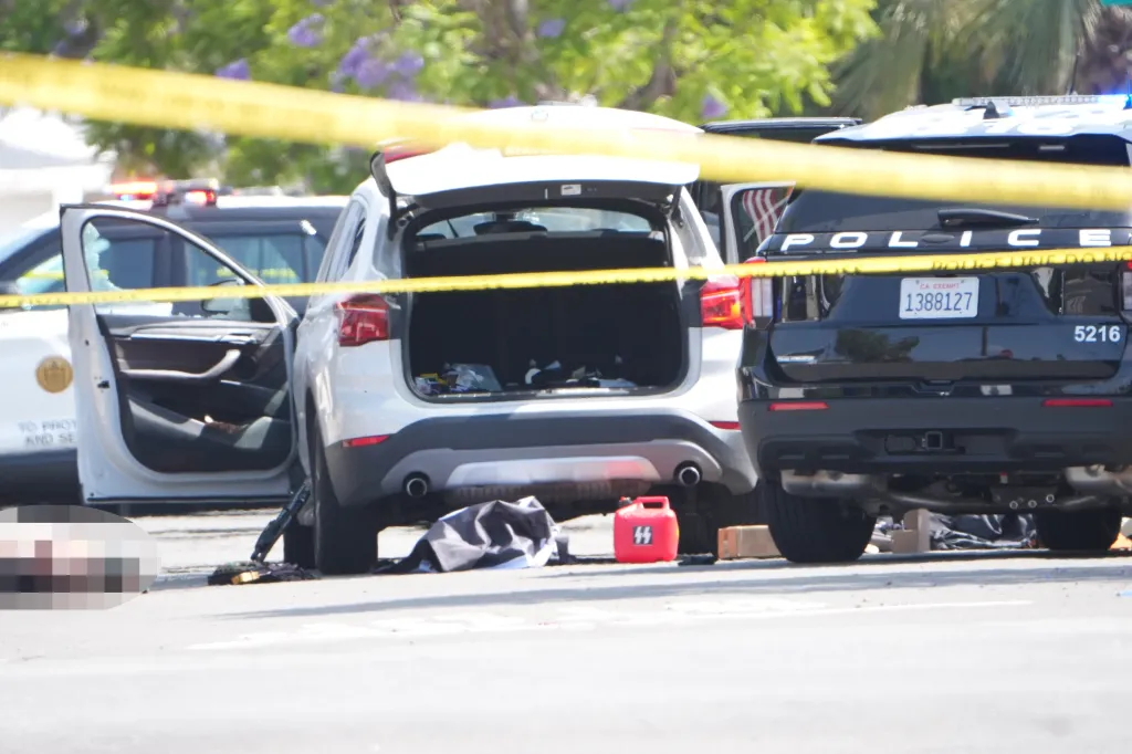 Emergency services deployed at an active shooter scene with a gas can displaying SS symbols.
