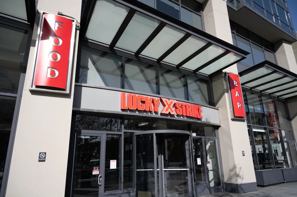 The entrance to a Lucky Strike bowling venue and bar.