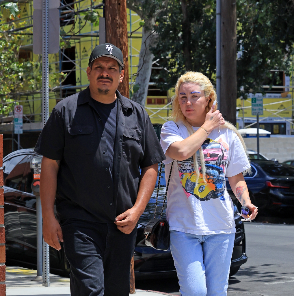 Amanda Bynes and Zachary Khan holding hands while walking in Los Angeles.