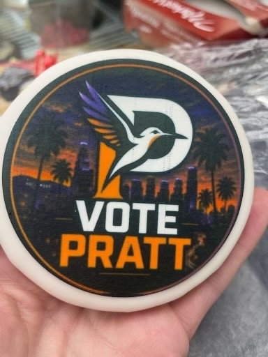 Cookie with Spencer Pratt for Mayor campaign logo.